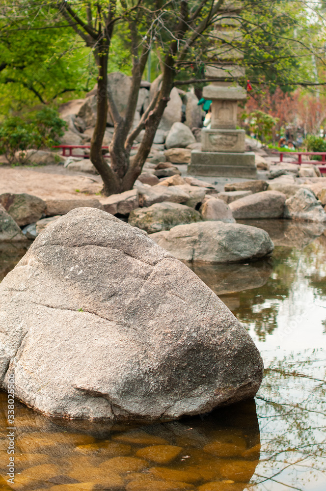 large stone in an artificial water reservoir.. large stone in an artificial water reservoir..