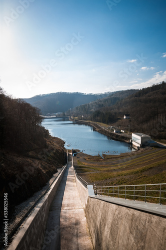 A magnificent view from the dam in the German Harz. Blue sky reflected in water