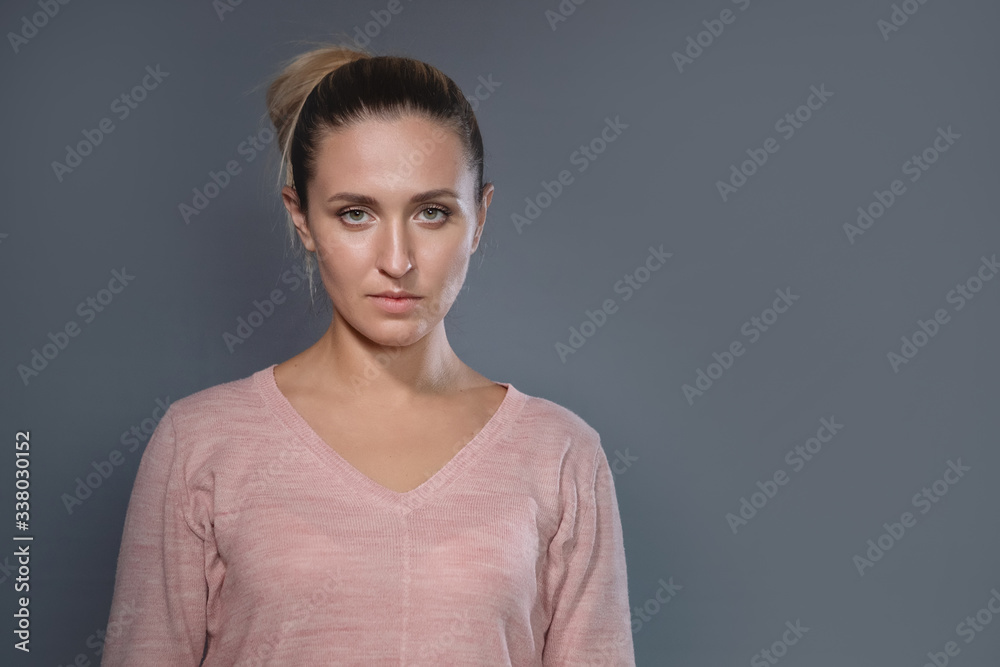 Portrait of woman with a hair bun. Portrait of woman with a hair bun.