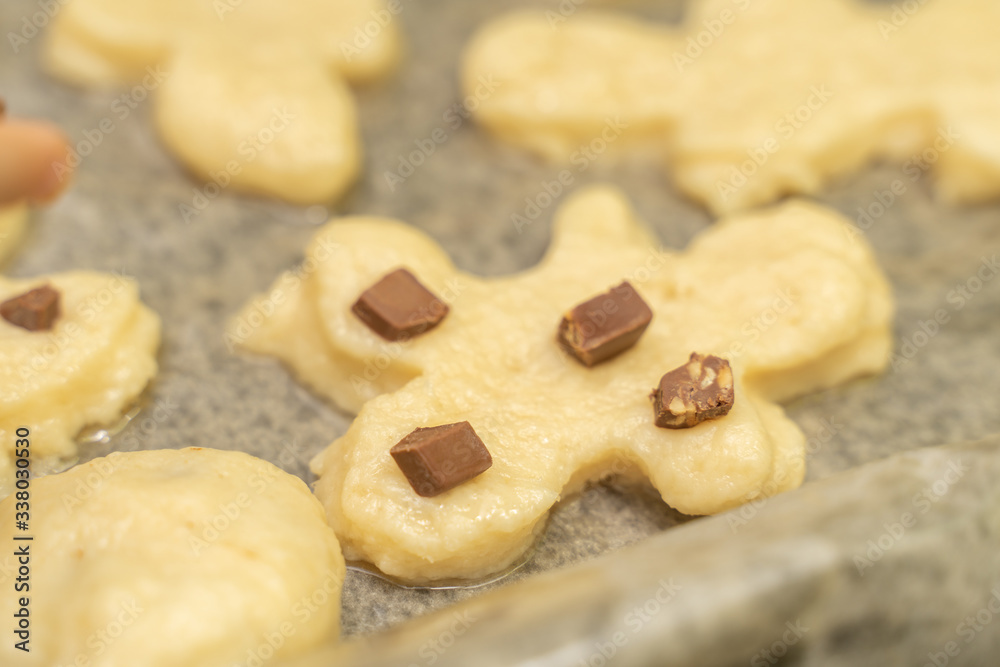 homemade cookies in the shape of men on a baking sheet before bakingculinary background homemade cookies in the shape of men on a baking sheet before bakingculinary background