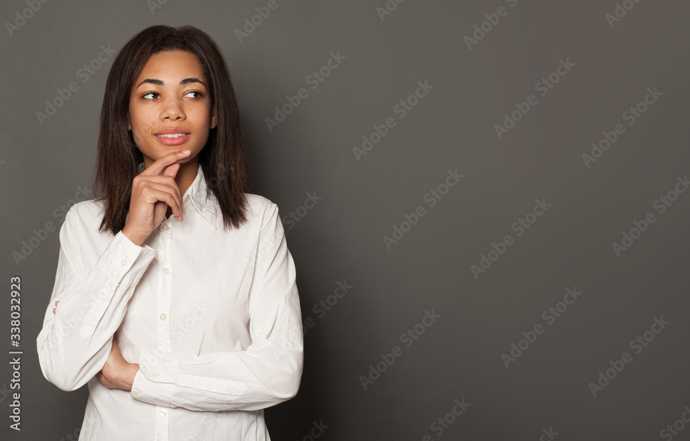 Young perfect fashion model woman thinking and smiling on brigt yellow background Young perfect fashion model woman thinking and smiling on brigt yellow background