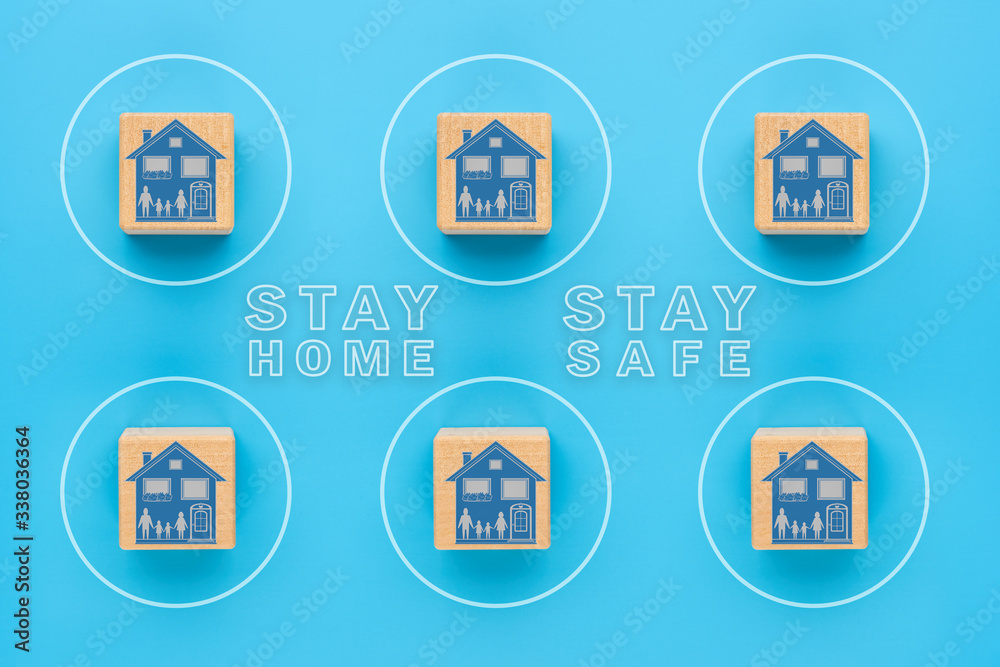 Stay safe at home, a self-isolation concept to protect against the COVID-19 coronavirus. Wooden cubes with the image of a house, separated from each other, the concept of infection prevention. Stay safe at home, a self-isolation concept to protect against the COVID-19 coronavirus. Wooden cubes with the image of a house, separated from each other, the concept of infection prevention.