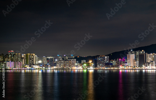 Gwangan Beach, a famous landmark of Busan, Korea, and the night view of the city © J. studio