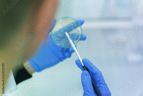 Young female Laboratory scientist working at lab with test tubes, test or research in clinical laboratory.Science, chemistry, biology, medicine and people concept.