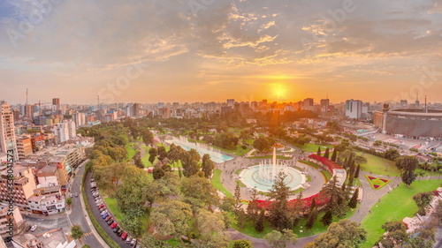 Aerial sunset view to Park of the Reserve with magic water circuit biggest fountain complex timelapse