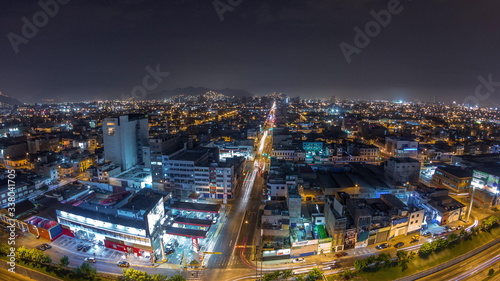 Wallpaper Mural Panoramic skyline of Lima city from above with many buildings aerial night timelapse. Lima, Peru Torontodigital.ca