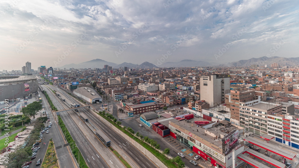 Aerial view of Via Expresa highway and metropolitan bus with traffic timelapse. Lima, Peru