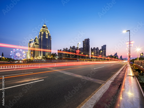Night background of traffic road and modern city 