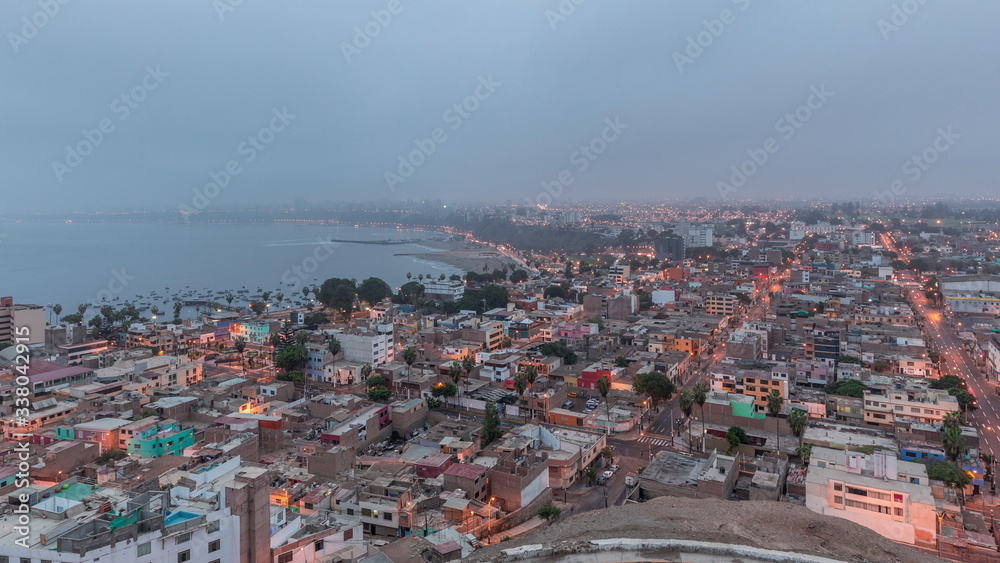 Naklejka premium Panoramic skyline of Lima city from above with many buildings aerial night to day transition timelapse. Lima, Peru