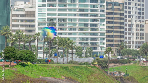 Paragliding on a cliff in Parque del Amor or Park of Love in Miraflores district timelapse. Lima, Peru