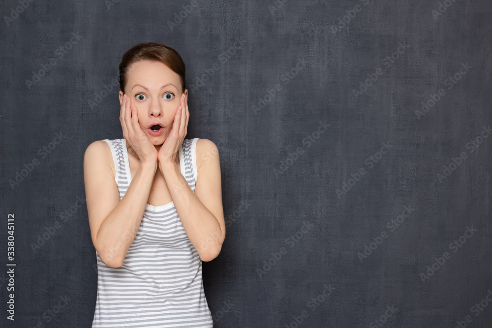 Portrait of shocked surprised girl with widened eyes and open mouth Portrait of shocked surprised girl with widened eyes and open mouth