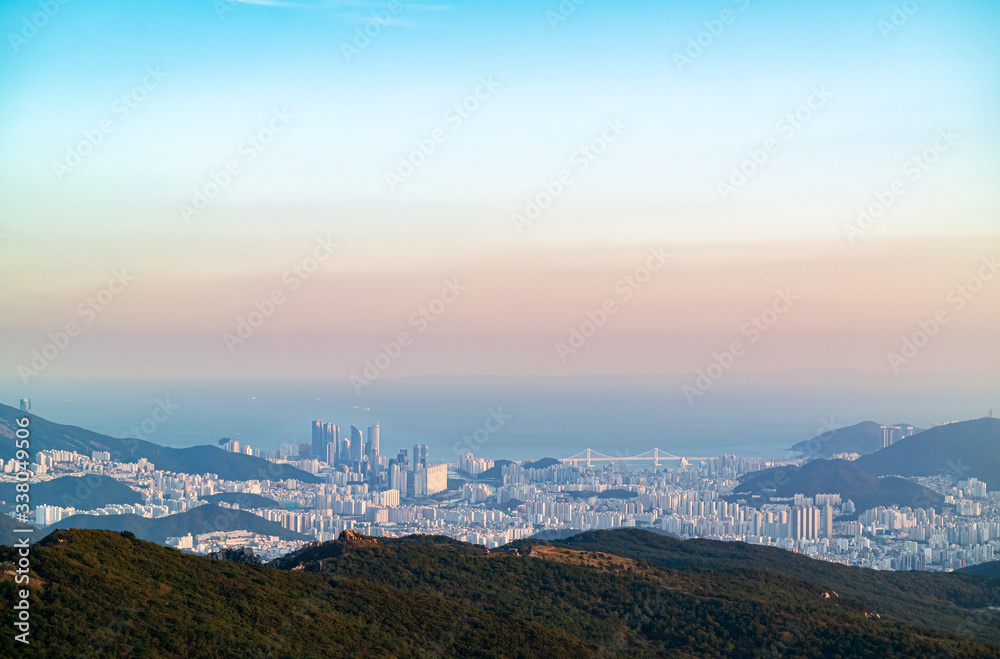 Fototapeta premium The view of Haeundae area and the sea from the top of the famous mountain in Busan, Korea