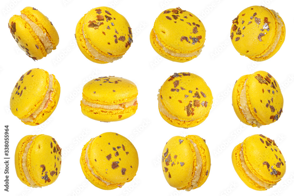 Fototapeta premium Macro photo of french yellow macaroon isolated on white background, clipping path.