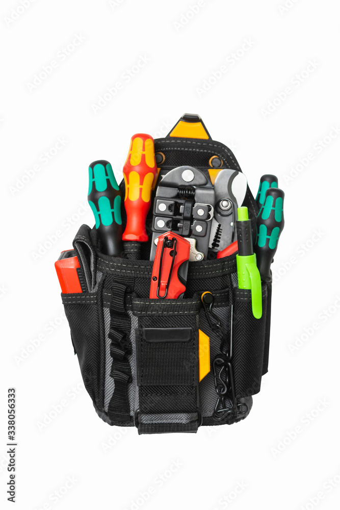 Black electrician and fitter's bag with tools on a white insulated background. Electrician's tools in the mounting bag. Isolated Black electrician and fitter's bag with tools on a white insulated background. Electrician's tools in the mounting bag. Isolated