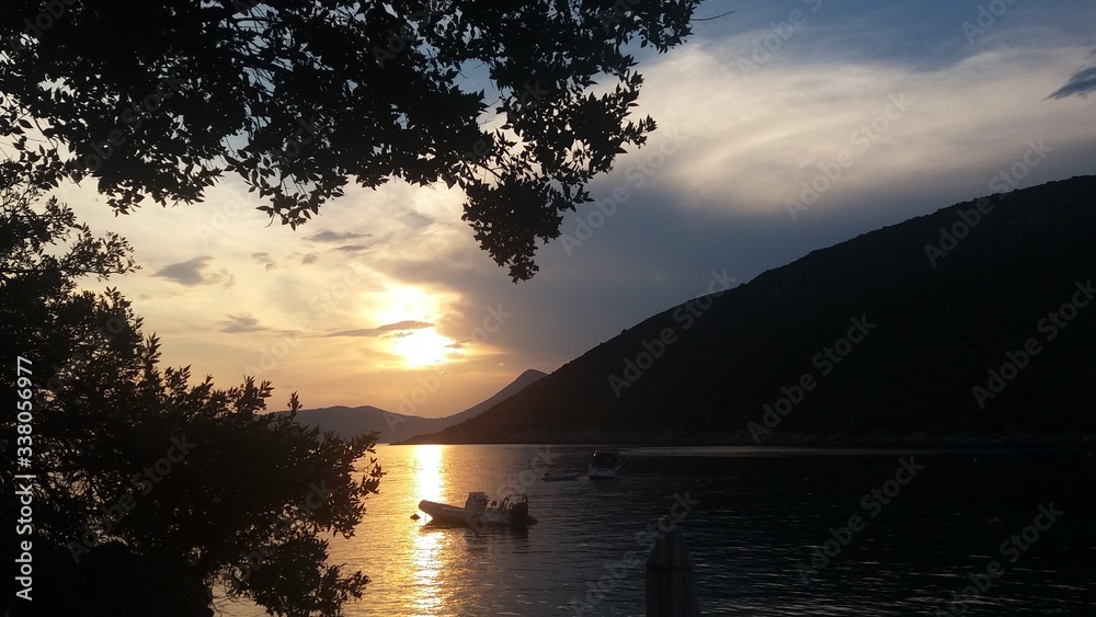 Sundown with boat at Montenegro beach