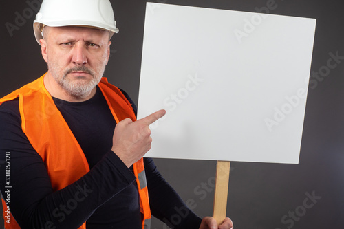 Protesting builder. Man in ...