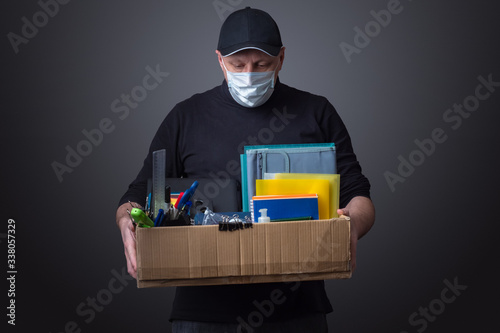 Sad man with a box in his h...