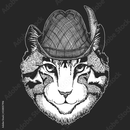 Face of domestic cat. Oktoberfest. Tirol traditional hat. Beer festival. Portrait of animal. Cute kitty, kitten.