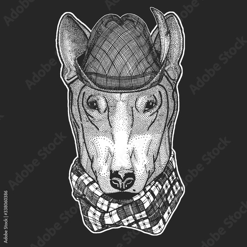 Bullterrier, dog. Oktoberfest. Tirol traditional hat. Beer festival.