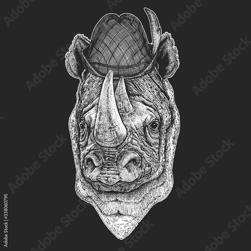 Rhinoceros, rhino portrait. Oktoberfest. Tirol traditional hat. Beer festival. Head of wild animal.