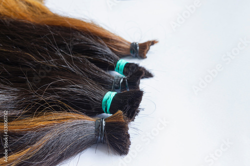 hair tied together for do wig on with background, donated to people with cancer