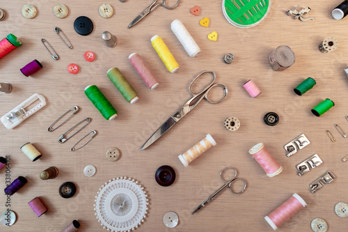 Flat lay composition of supplies for sewing, tailoring, doing needlework and embroidery at home