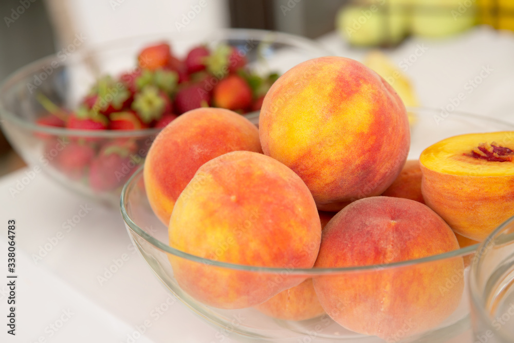 Peaches in a glass dish. Peaches in a glass dish.