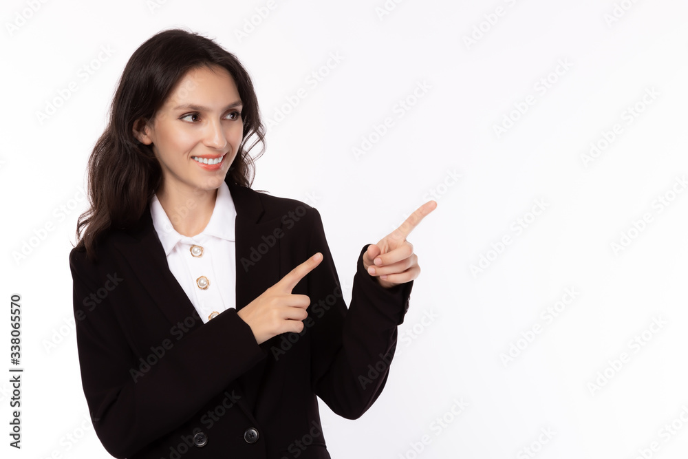 Smiling caucasian business woman pointing up and looking at copy space with satisfied, happy, smiley face. Attractive beautiful young businesswoman wear suit, shirt. business concept white background Smiling caucasian business woman pointing up and looking at copy space with satisfied, happy, smiley face. Attractive beautiful young businesswoman wear suit, shirt. business concept white background