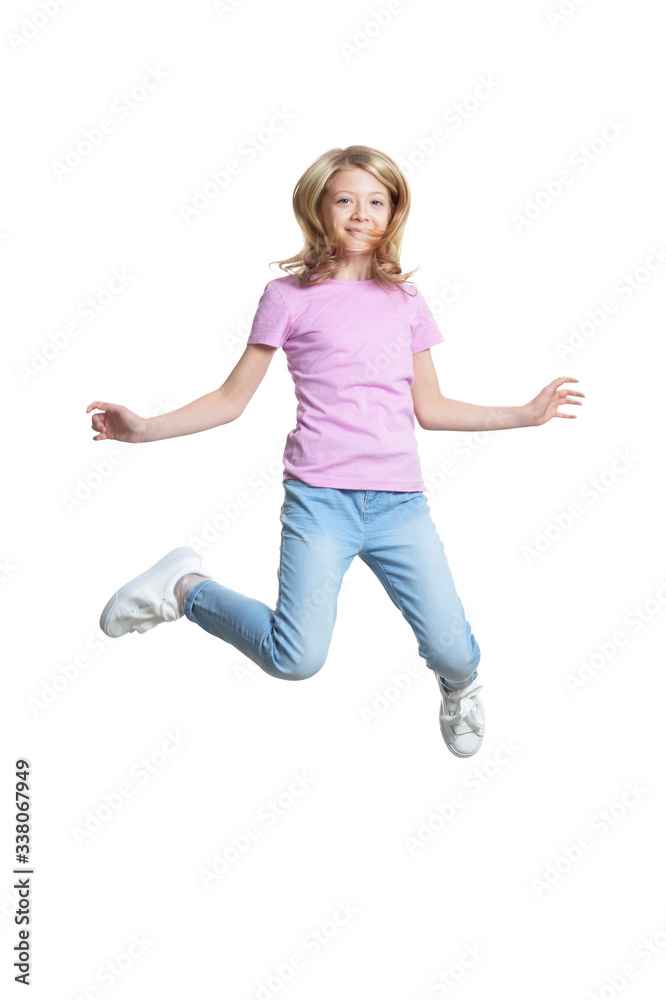 Cute little girl jumping isolated on white background
