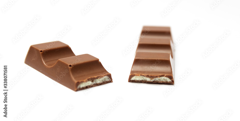 Broken chocolate bar isolated on a white background. Broken chocolate bar isolated on a white background.
