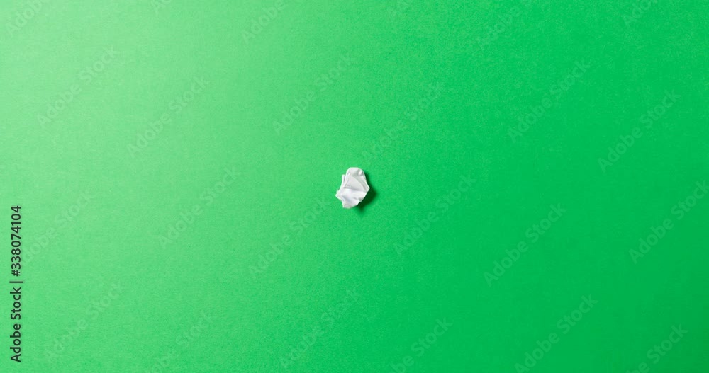 stop motion animation paper wrinkles making a paper ball, green and white color