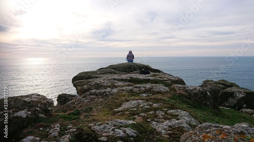 Girl on the rocks. Yoga time photo