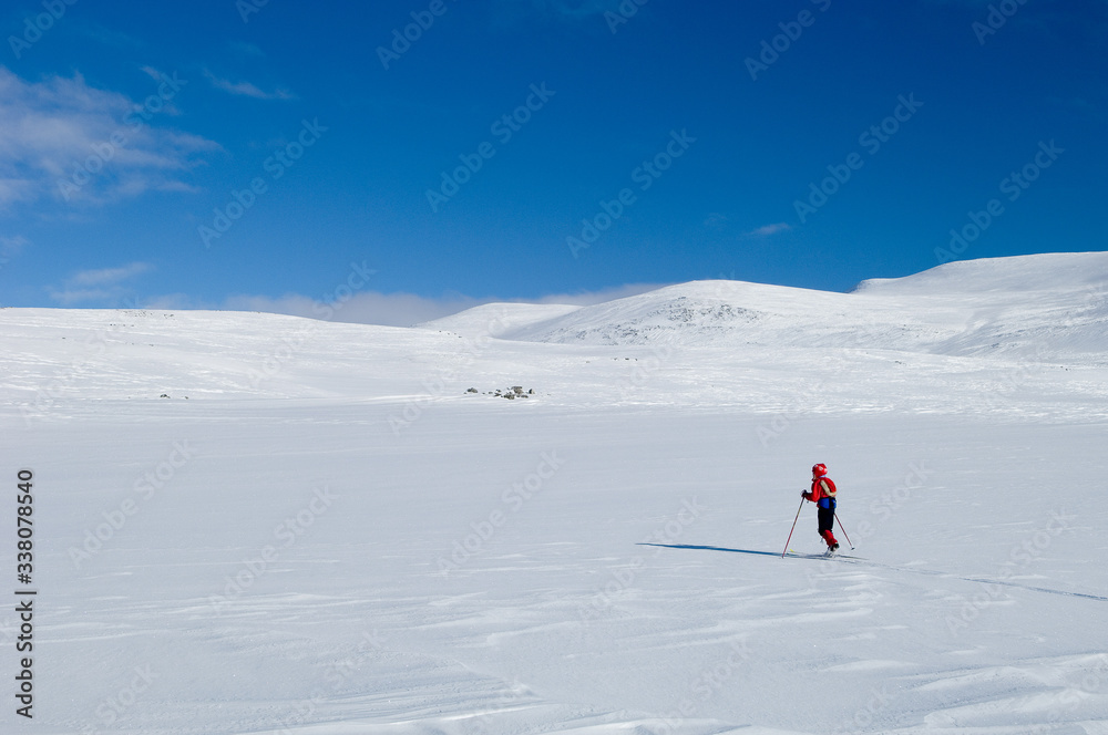 Girl skiing in Norwegian mountains