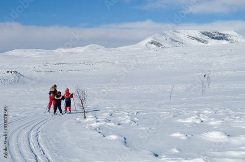 Family skiing in Norwegian mountains
