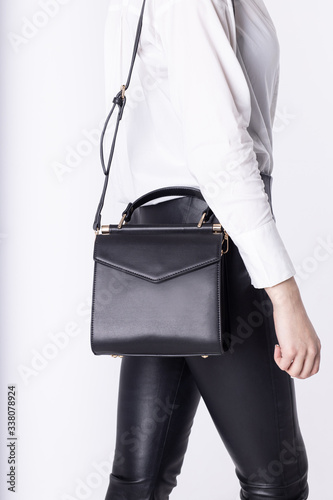  Model girl with leather elegant women bag. Fashionable female handbag, isolated