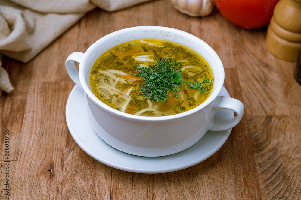 Chicken soup bouillon in a plate Chicken soup bouillon in a plate