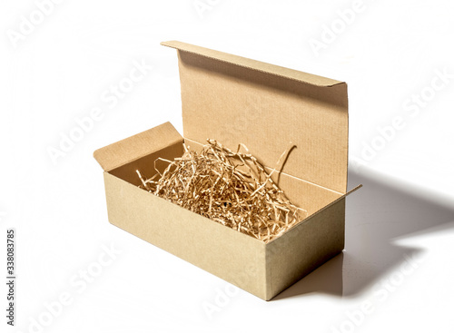 cardboard box with paper shavings inside