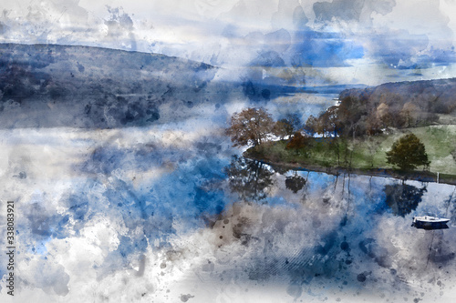 Digital watercolor painting of Breathtaking vibrant aerial drone landscape images over Coniston Water at sunrise on beautiful Autumn Fall morning © veneratio