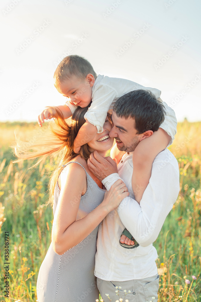 Happy family - father, mother, baby son have fun together. Travel lifestyle, parents with kids on summer vacation Happy family - father, mother, baby son have fun together. Travel lifestyle, parents with kids on summer vacation