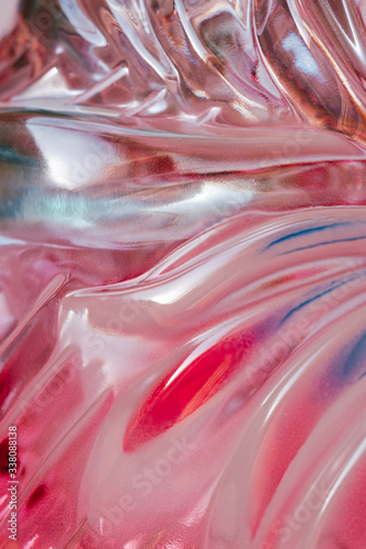 Abstract texture of colored rippled glass