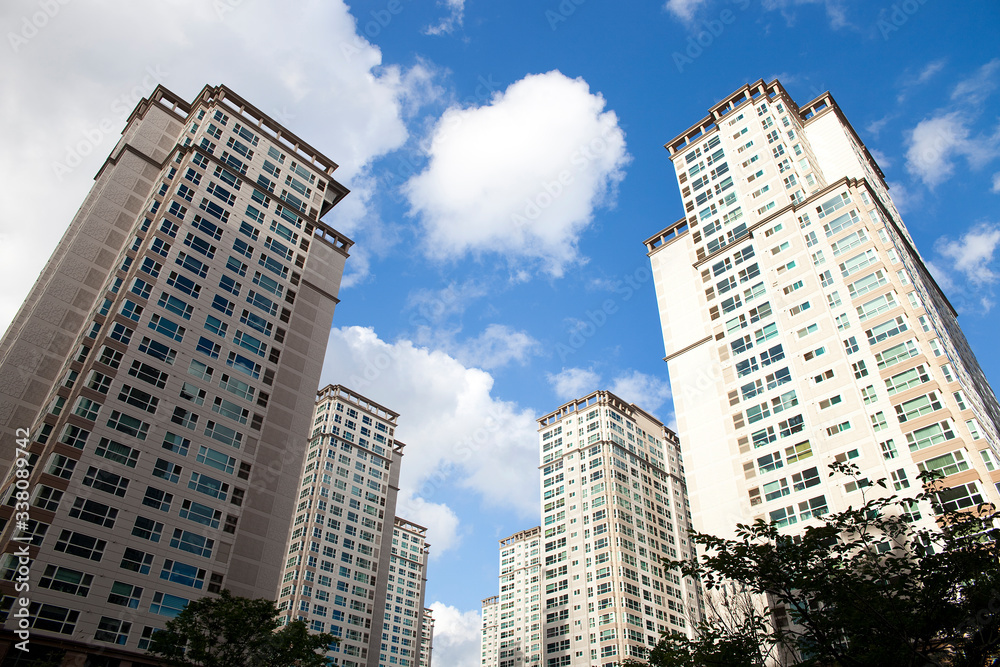 High-rise apartment viewed from below.