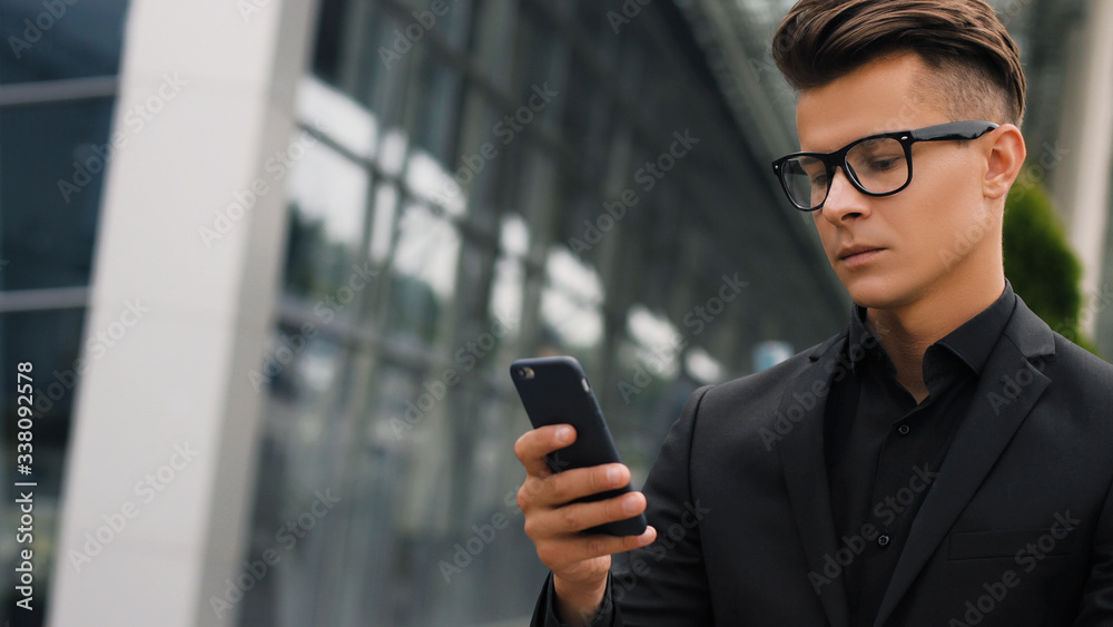 Closeup portrait of handsome businessman using smartphone. Closeup portrait of handsome businessman using smartphone.