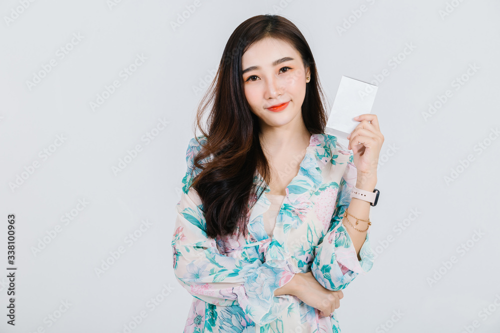 A beautiful Asian woman is smiling and holding box of product about body & skin care. A beautiful Asian woman is smiling and holding box of product about body & skin care.
