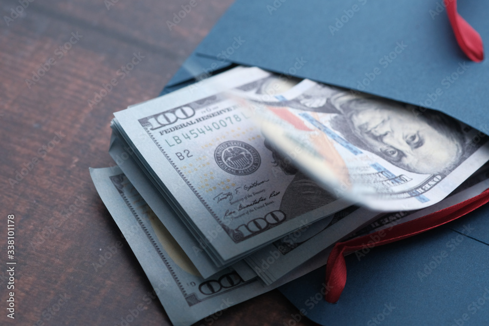 close up of US dollar cash in envelope.