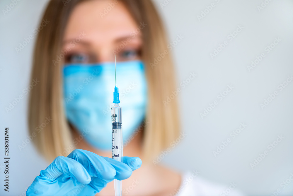 Syringe for injection in nurse hand. Medical glass vial for vaccination. Science equipment, liquid drug or vaccine Syringe for injection in nurse hand. Medical glass vial for vaccination. Science equipment, liquid drug or vaccine