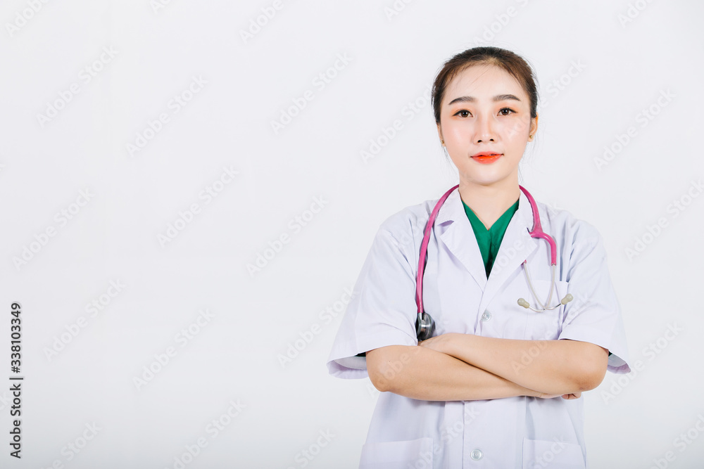 Portrait of young confident woman wearing surgical gown with isolated white wall background. Healthcare worker and Medical concept. Portrait of young confident woman wearing surgical gown with isolated white wall background. Healthcare worker and Medical concept.