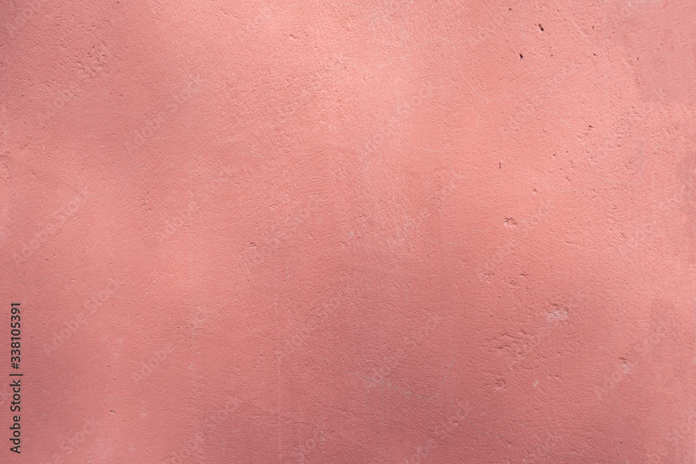 Texture of the wall painted in red. External part of an architectural structure. Texture of the wall painted in red. External part of an architectural structure.