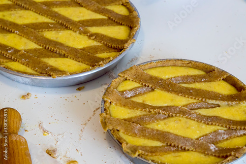 Preparation the typical Neapolitan Easter cake, Pastiera, typical homemade dessert, with eggs, flour, sugar and vanilla, wheat, orange essence