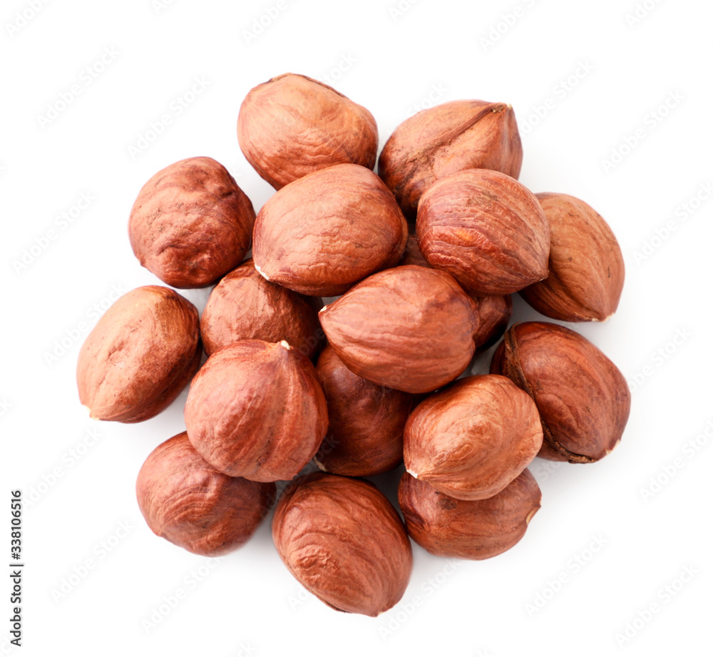 Pile of hazelnuts on a white. The view from top Pile of hazelnuts on a white. The view from top