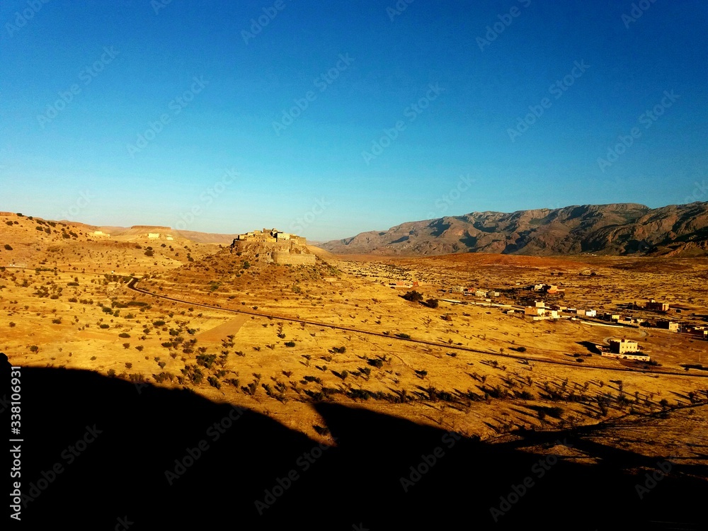 Scenic View Of Landscape Against Clear Blue Sky